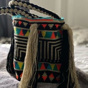 Multicolor shiny bag handmade using a unique technique and a special thread .